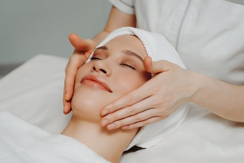 Woman relaxing during full body massage at spa